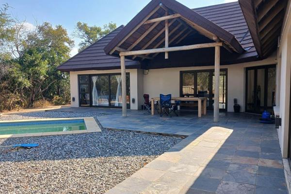 Welcome to your dream home in the picturesque Moditlo Wildlife Estate, Limpopo, South Africa. This stunning 3-bedroom, 2-bathroom house ...