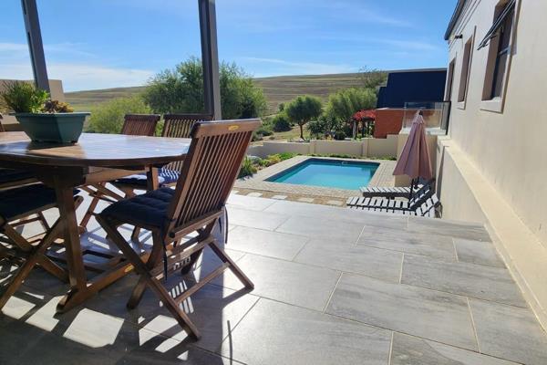 Set amidst the tranquil beauty of the Swartland, this contemporary 4-bedroom home ...