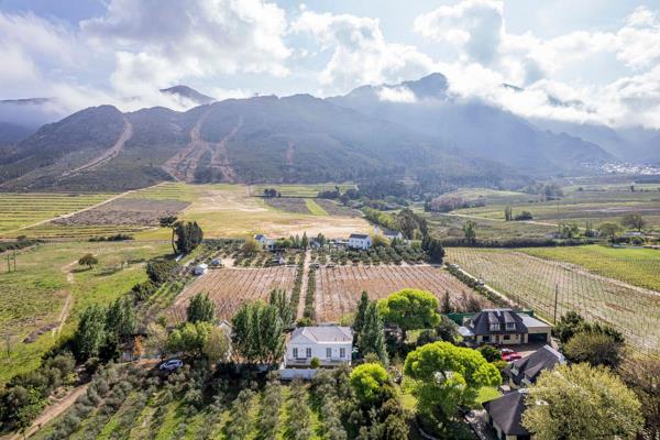 Seldom does one find a large residential stand amongst Farmlands, this is a historic gem that should not be overlooked.  This property is some 7246 m2 in extent and has a small olive grove. It is situated within close proximity of the bustling Village of Franschhoek where ...