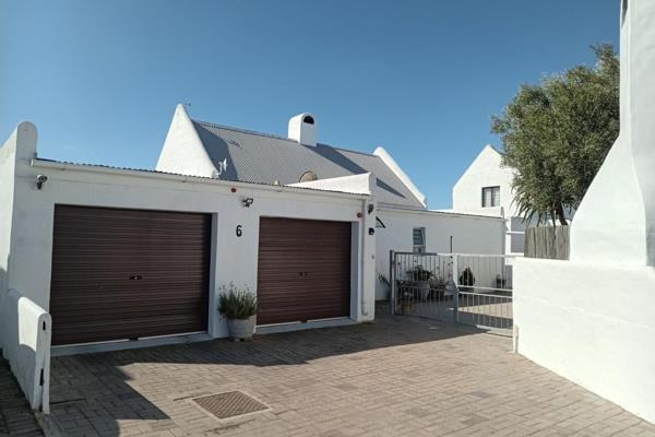 Discover a cozy and inviting 3-bedroom home in Veldpark 1, Laaiplek, Cape West Coast ...