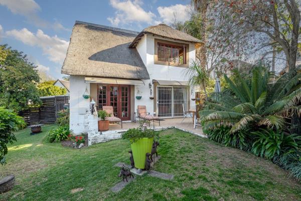 Superb thatched home with gracious beauty and a spectacular garden offers 3 exceptional sized bedrooms, 2 bathrooms with and abundance ...