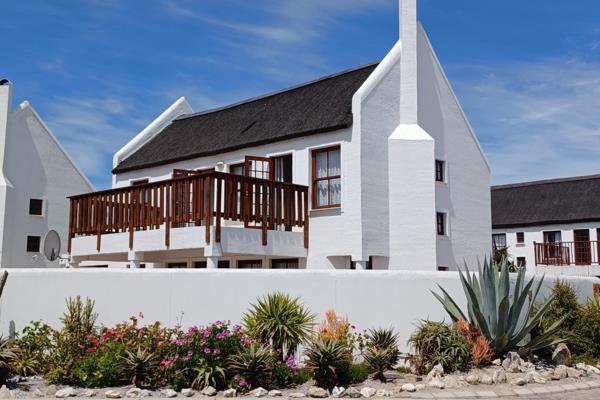 Beautiful thatched reed-roof house near the sea on the Cape West Coast for sale in the ever popular town of Dwarskersbos.

The home is situated in a gated community with controlled access to give you privacy and security. The ...