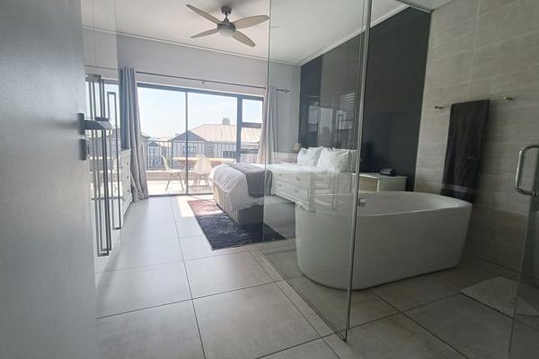 EXCLUSIVE MANDATE BY HARCOURTS LIFESTYLE, SOUTH AFRICA
Discover luxury living in this exquisite 2-bedroom apartment, perfect for those seeking comfort and style. This modern unit features an open-plan dining and lounge area that seamlessly extends to a covered patio with a ...