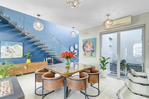 This stunning, interior-designed double-storey townhouse, located in a secure 24 hour guarded complex, combines sleek modern finishes ...