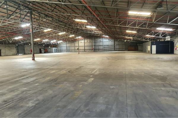 This expansive 7459m2 warehouse is situated in a secure industrial complex, offering a ...