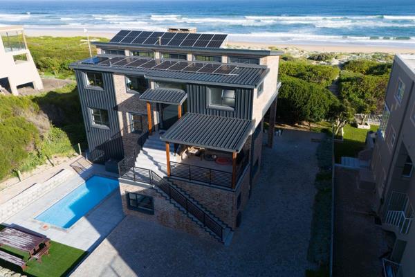 This master-built 6-bedroom (or 5-bedroom with study) property is on a prime beachfront ...