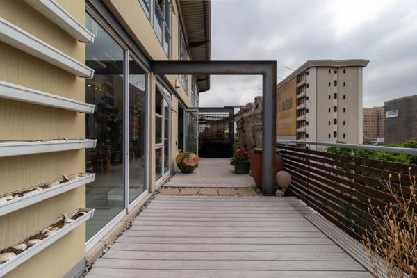 Nestled in the vibrant heart of Braamfontein, this stunning penthouse is ready for its ...