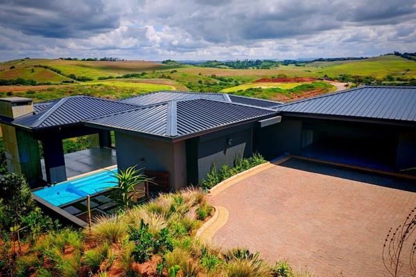 This  brand new, contemporary home has a creative design that takes full advantage of the spectacular surroundings, provides indoor and ...