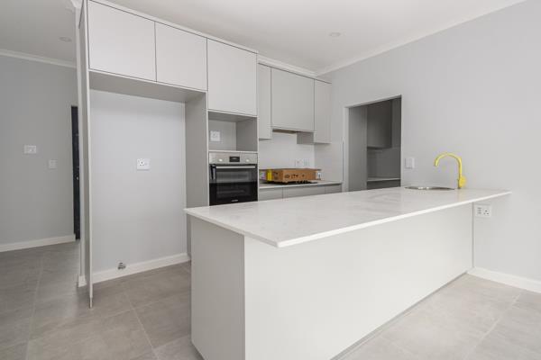 Brand new duplex home with a modern open plan kitchen and connected scullery with a guest bathroom downstairs which opens to a large ...