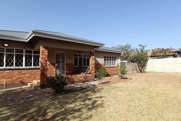 Step into this charming home through a welcoming patio leading to the open-plan lounge and dining room—perfect for family ...