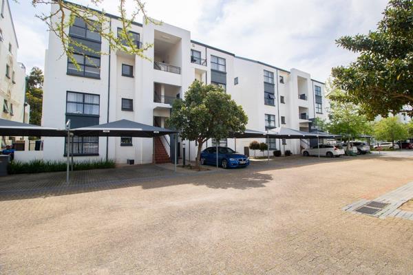 This sleek, lock-up-and-go one-bedroom apartment in a secure estate offers modern ...