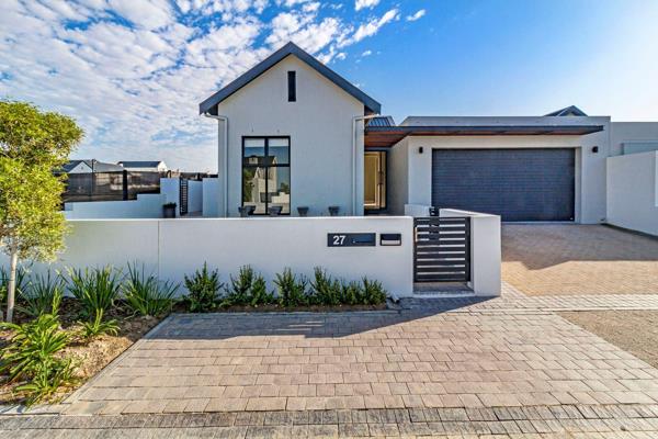 This modern home was designed with family living in mind. It is an entertainers dream with a flowing large open-plan kitchen, dining ...