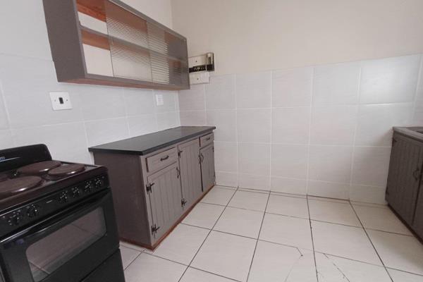 The flat features a spacious bedroom with built-in cupboards, a separate living area, and a bathroom equipped with a bath, toilet ...