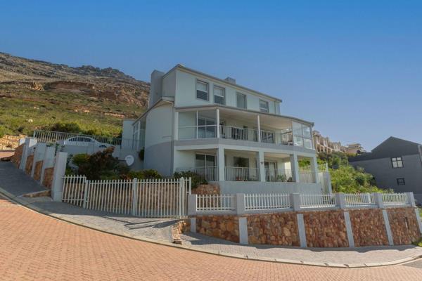 Situated against the mountainside on a corner erf allowing for uninterrupted views across False Bay and just a 5 minute drive to the ...