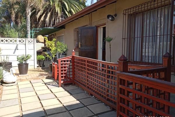 Tiled Lounge and cozy dining room. Separate kitchen with wooden cupboards. Stand-alone stove. A Washing machine connection. One ...