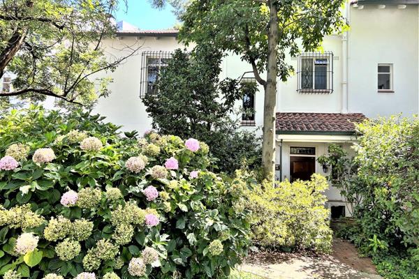 This lovely triple story townhouse has gorgeous parquet flooring installed throughout ...