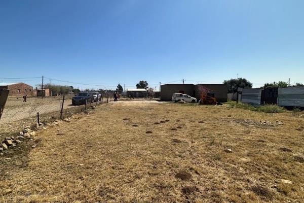 This vacant land already has a building on it with running water and power lines. It uses a septic tank which is located under ...