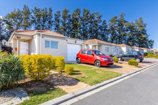 Security guard at the entrance gate.
Open-plan living area with air-conditioner.
Kitchen with breakfast nook, built-in cupboards and ...