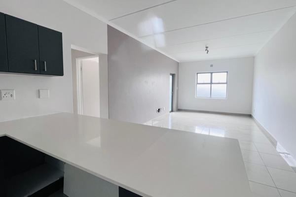 This spacious, modern and safe three-bedroom apartment has an open plan kitchen onto the ...