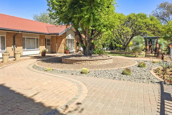 Nestled in the charming heart of Hoopstad, this beautifully crafted home offers a unique blend of comfort, security, and aesthetic ...