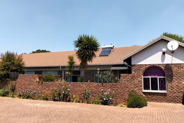 Welcoming tiled entrance hall to the spacious open plan Dining &amp; Lounge with sliding door leading to the neat garden.
Separate ...