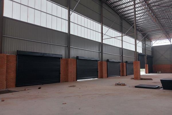 Multiple on grade roller doors of varying sizes &amp; loading docks, massive racking height, sprinkler system &amp; 2500m private yard ...