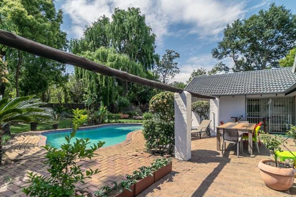 Located in a secure gated street, this picturesque 4-bedroom, 3-bathroom English cottage-style home offers an idyllic retreat with a ...