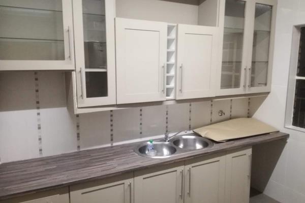 Kitchen with extra cupboards and double sink

Dinning and Lounge tiles

3 spacious bedrooms with laminated wood

2 ...