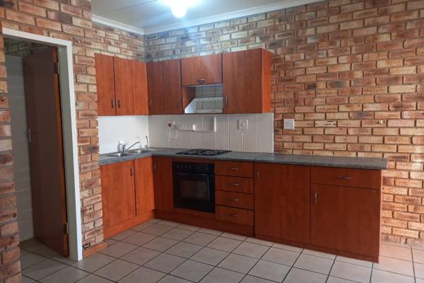 One bedroom flat in well maintained complex with carport