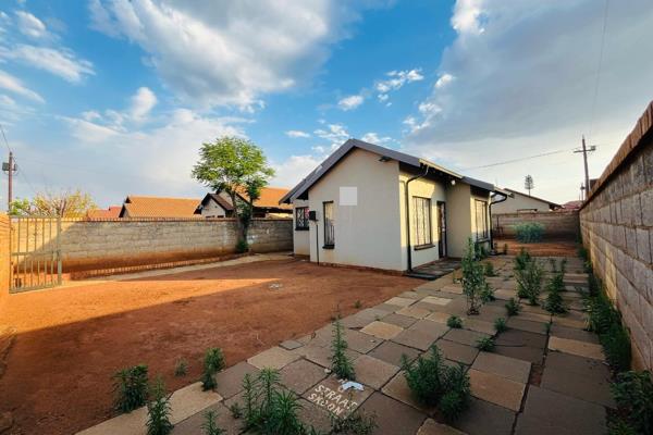 This fully tiled, low-maintenance two-bedroom house offers a welcoming and modern living ...