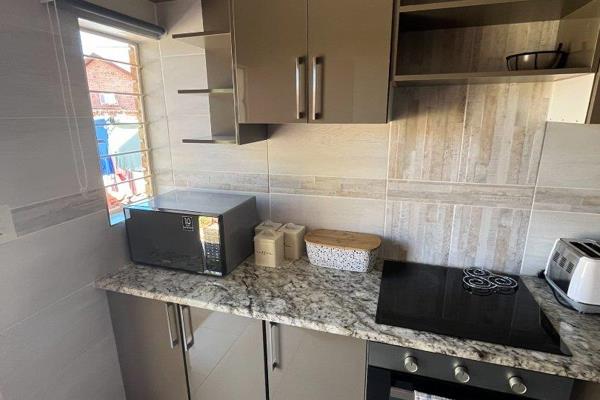 Kitchen

Living area

Bathroom with a bath.

Located close to shops and other ...