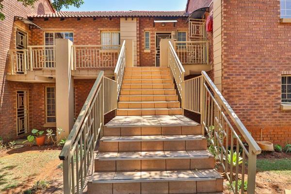 The modern kitchen boasts ample cupboard space and a breakfast nook. 
The open-plan living area extends to a spacious covered patio ...