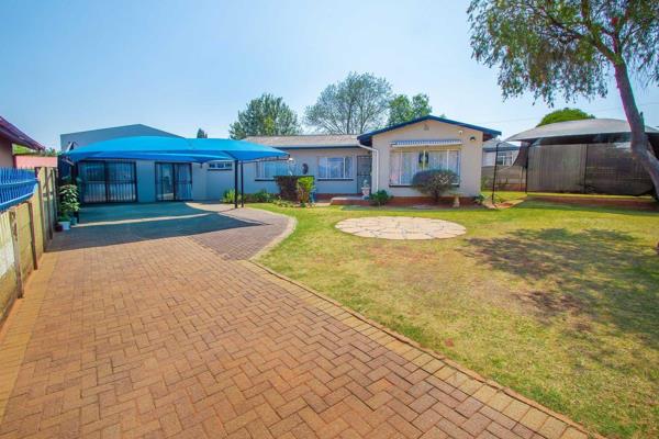 Welcome to this stunning family home, nestled on a spacious 900sqm erf with beautifully manicured wrap-around gardens. 

The property ...