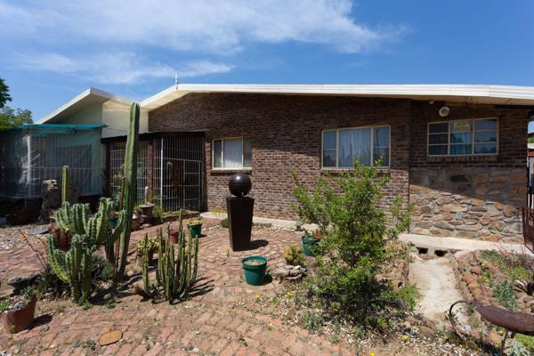 This home boasts three bedrooms and 2.5 bathrooms in the main house, along with a flatlet that also has a bedroom and bathroom. There ...