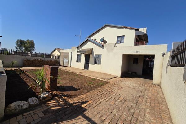 This double storey house is situated in Lenasia Ext 13. It offers 4 spacious bedrooms and 3 bathrooms. Downstairs, it offers an open ...