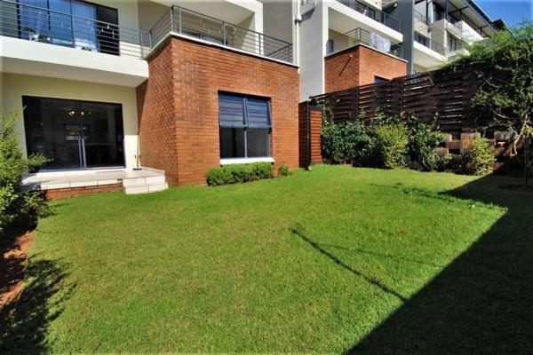 Contemporary 3Bed 2Bath Garden Unit in a Lifestyle Estate.
Elegant, Spacious and Inviting!
Modern open plan kitchen featuring a ...