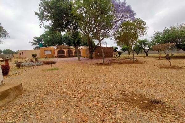 This plot features 
three bedrooms 
two bathrooms 
dining and lounge area 
kitchen with built in cupboards 
outside 
borehole ...