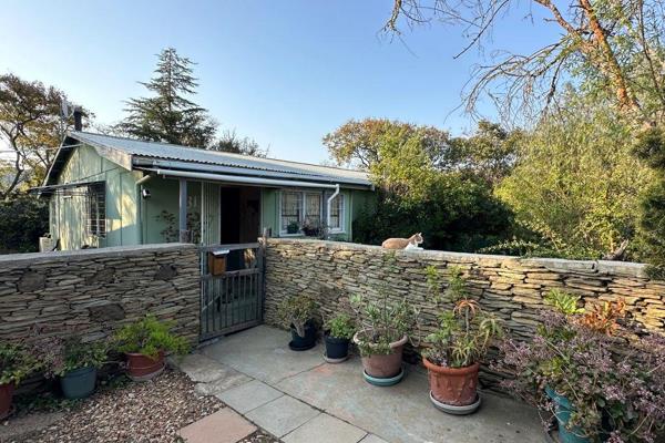 This charming typical Padkamp house from the 1970s, built during the construction of the Tradouw Pass, offers a unique and quirky, 120 sqm home featuring beautiful wooden floors, with three spacious bedrooms, one bathroom, and an ...