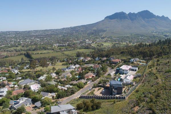 Nestled on a picturesque mountain slope, this stunning plot of South African soil is ...