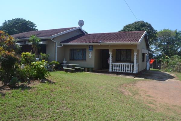 A home that is well loved with a well established garden with flower bushes and fruit trees. This family home is tiled throughout with ...