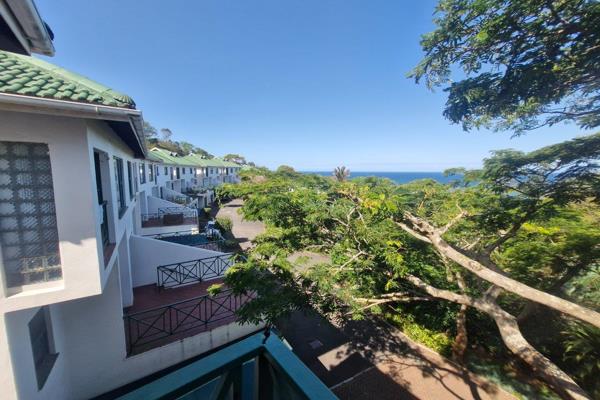 This Double story features an open plan dining and living room area which opens up onto an elevated patio with ocean views as well as ...