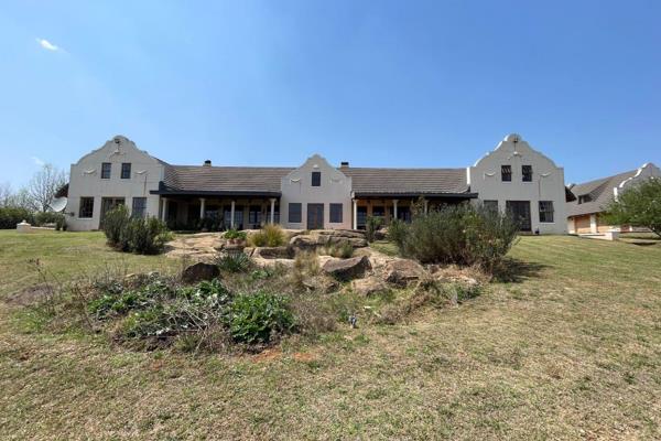 A charming smallholding tucked away along the peaceful Valley View Road with front row positioning, this Cape Dutch-style home in ...