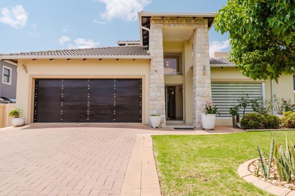 This stunning north-facing home, designed with style and precision, features double-volume ceilings and spacious open-plan living ...