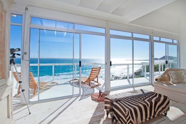 Located in the peaceful coastal enclave of Misty Cliffs, this timber-framed beach house ...