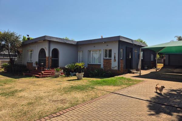 As you enter through the automated gate, a spacious driveway welcomes you, leading to two double carports shaded with protective nets ...