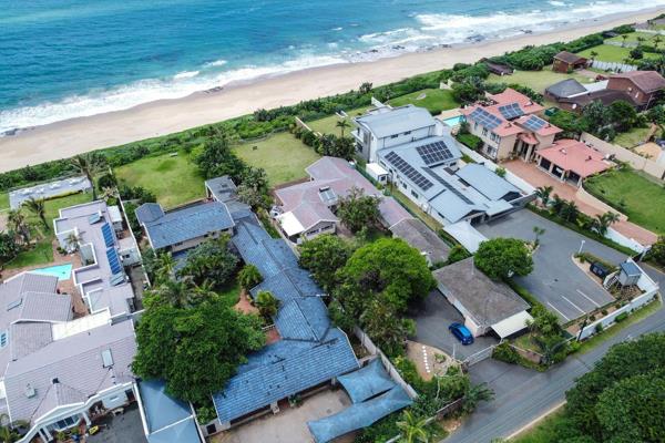 Enjoy incredible sunrises from this unique family home perched on the edge of the ocean at a prime Amanzimtoti address.

This seafront ...