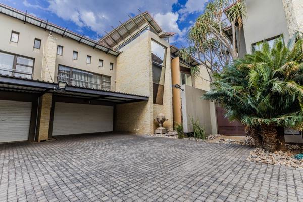 This unique townhouse is a rare find, featuring a stunning butterfly roof that combines ...