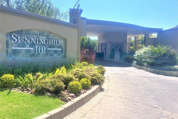 This spacious upstairs upstairs  apartment in Sunninghill has a comfy lounge suite  2 ...