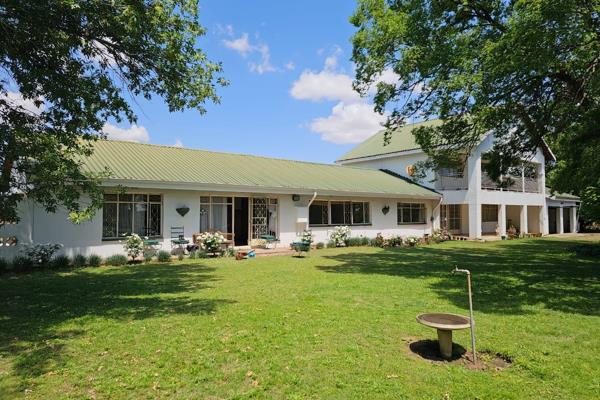 Nestled in a serene rural setting, this delightful double-storey farm house features:

- 7 spacious bedrooms and 2 full bathrooms ...