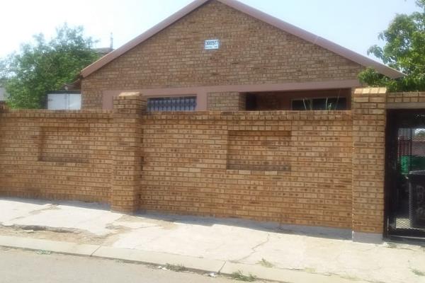 This charming 3-bedroom house in Naturena, featuring classic face brick design, is now ...